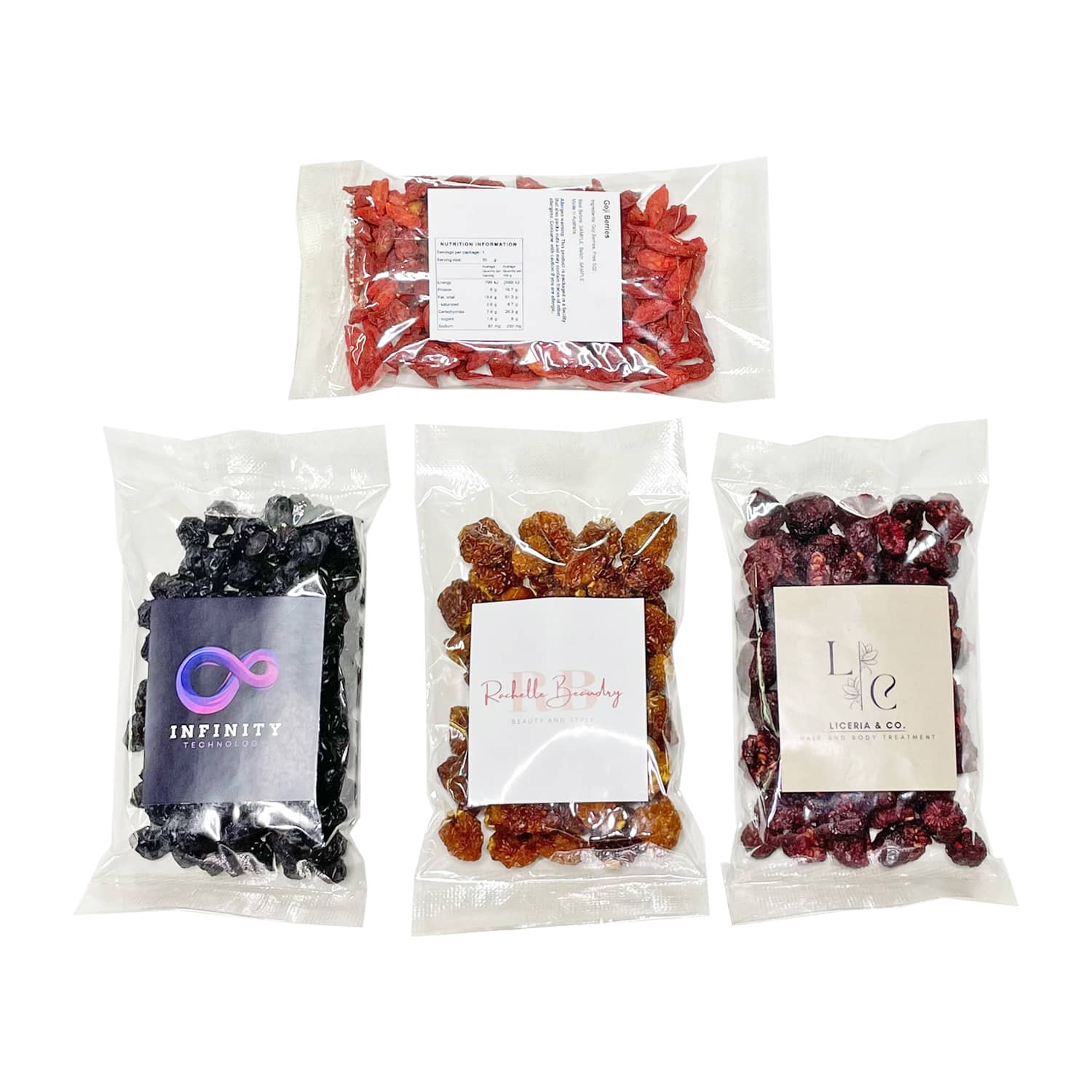 A variety of packaged snacks including red and black dried fruits, featuring different labels and colours. Superfood Snack Bag - Image 1