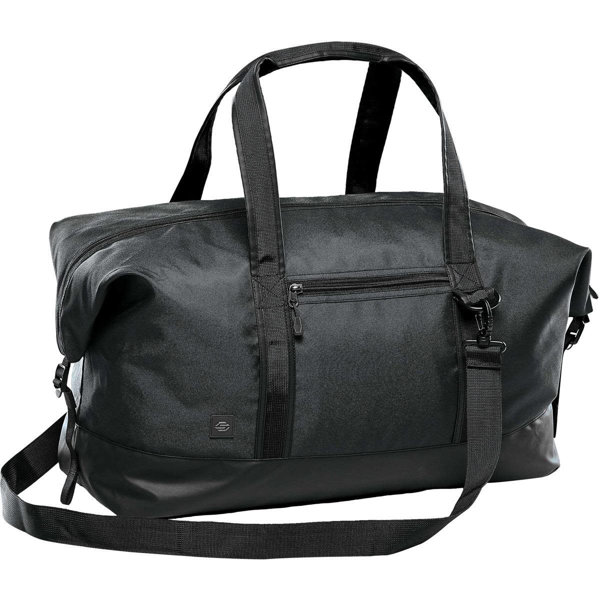 A black duffle bag with sturdy handles, a detachable strap, and a zippered front pocket, featuring a logo. Soho Gear Bag - Image 1