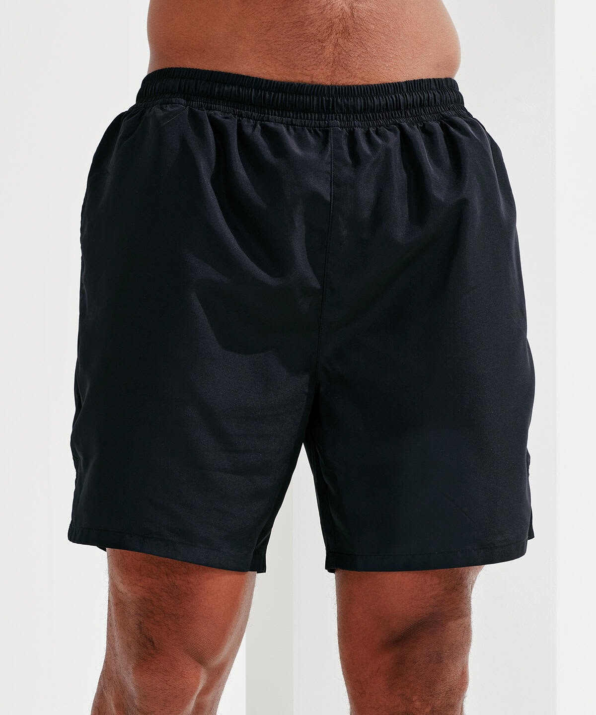 Black running shorts with an elastic waistband. The shorts feature a simple design and a relaxed fit. Running Shorts - Image 1