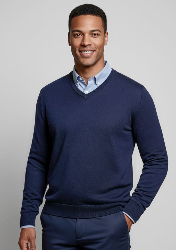 A navy knitted jumper with a V-neck and fitted cuffs, worn over a light blue collared shirt. Features a logo. Mens Roma Knit Pullover - Image 1