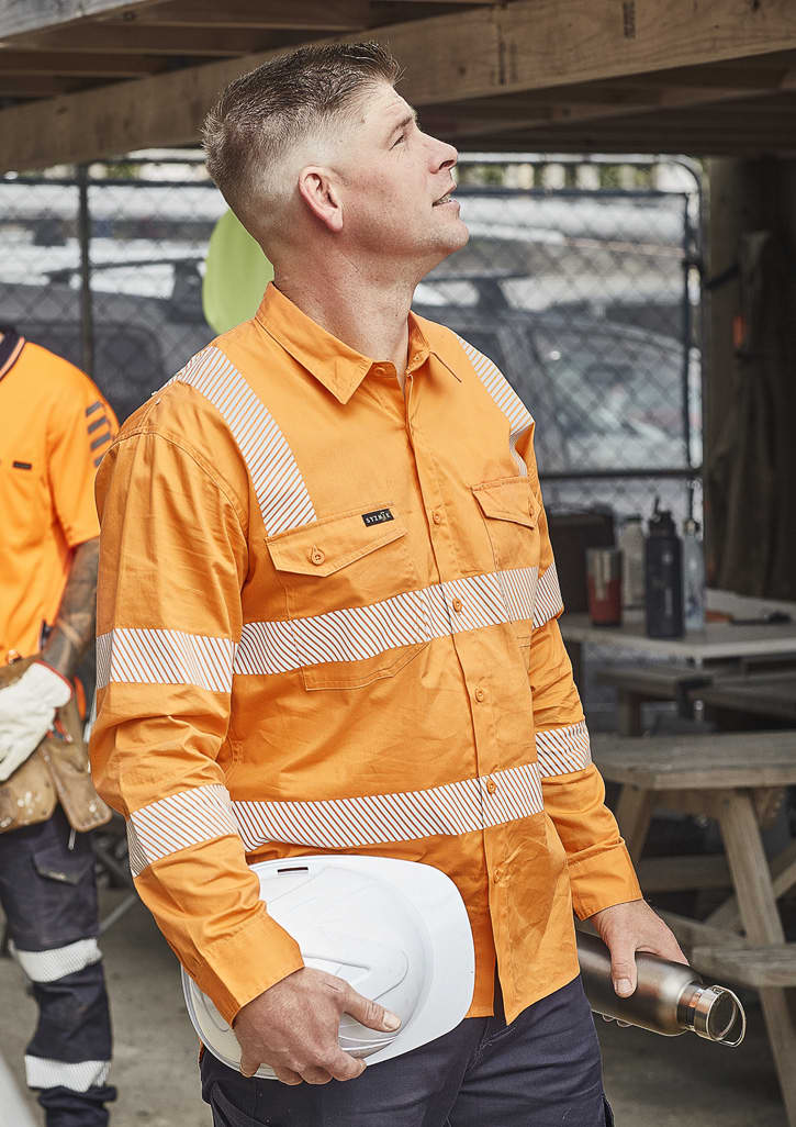 An orange long-sleeve work shirt with segmented reflective tape, featuring a pocket and a branding logo. Mens VIC Rail Shirt - Segmented Tape - Image 1