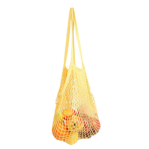 A yellow reusable cotton mesh shopping bag filled with various fruits. It features a simple design with long straps. Reusable Cotton Mesh Shopping Bag - Image 1