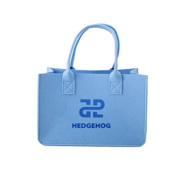A light blue customizable felt tote bag with two handles and a logo on the front. Customizable Felt Tote Bag - Image 1