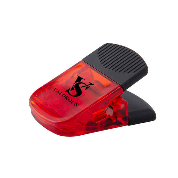 A red plastic magnetic clip with a black handle and a logo on the front. Promo Plastic Refrigerator Magnetic Clips - Image 1