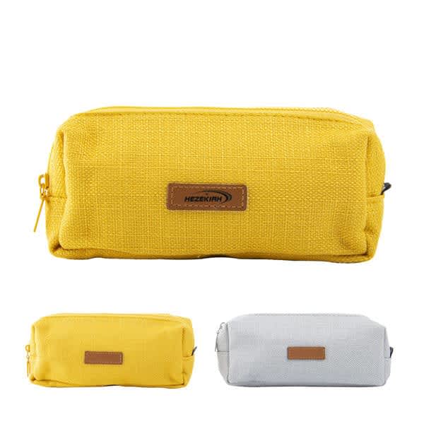 A yellow and a grey pencil case with zippers, featuring a logo patch on the side. Cotton Linen Pencil Case - Image 1