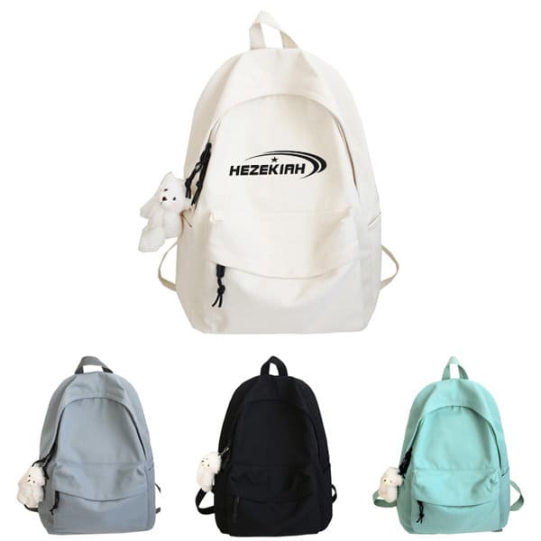 A cream canvas school backpack with a logo, accompanied by grey, black, and mint green versions. Pure Color Canvas School Backpack - Image 1