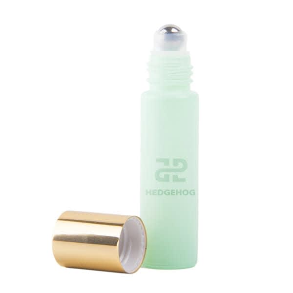 A mint green 10ml roll-on glass refillable perfume bottle with a gold cap and a logo. 10ml Roll On Glass Refillable Perfume Bottle - Image 1