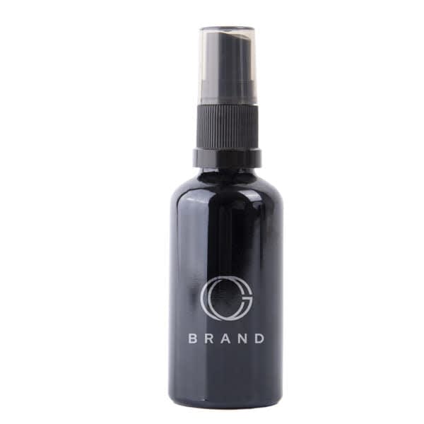 A 2 oz. black glass spray bottle with a nozzle and a logo on the front. 2 oz. Black Glass Spray Bottle - Image 1