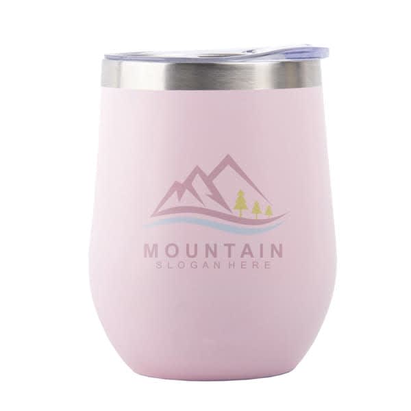 A pink stainless steel insulated wine tumbler with a lid and a logo featuring mountains and trees. 12 oz. Stainless Steel Insulated Wine Tumbler With Lid - Image 1