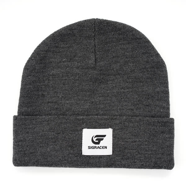 A grey cuffed beanie featuring a patch, showcasing a stylish and warm headwear option. Cuffed Beanie With Patch - Image 1