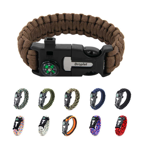A collection of multifunctional outdoor paracord survival bracelets in various colours, featuring a compass and clip closure. Multifunctional Outdoor Paracord Survival Bracelet - Image 1