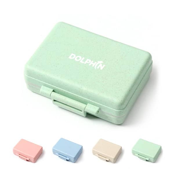 A green custom pill case made from wheat straw, featuring a logo, with options in pink, blue, and beige. Custom Wheat Straw Pill Case - Image 1