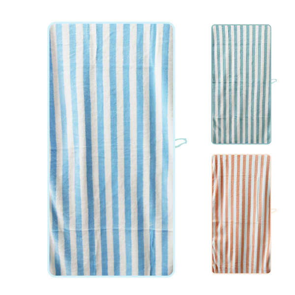 A striped bath towel in blue and white, alongside additional towels in other colours. Features a logo. Coral Fleece Striped Bath Towel - Image 1