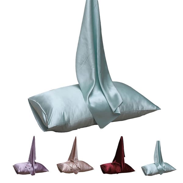 A silk envelope pillowcase in a soft blue shade, with options in pink, purple, and burgundy. Features branding. 22 Momme Silk Envelope Pillowcase - Image 1