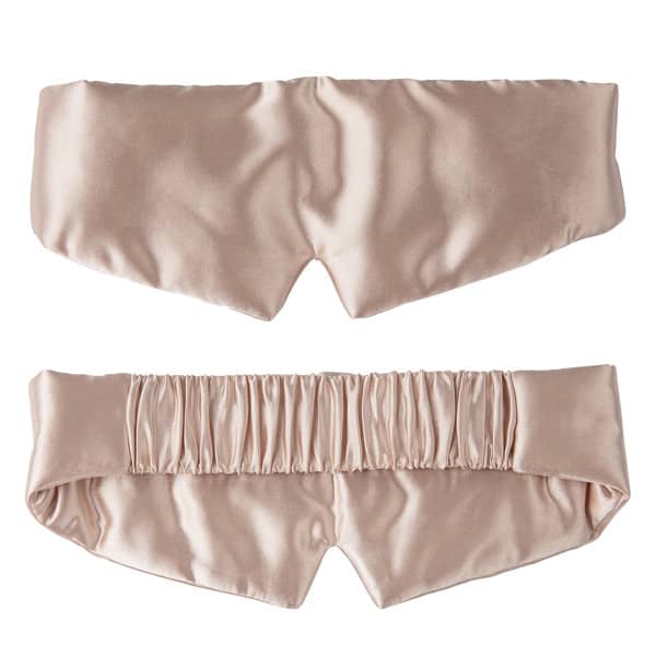 A satin silk sleep mask in a soft pink hue with an elastic band at the back and a smooth finish. Satin Silk Sleep Mask With Elastic Band - Image 1