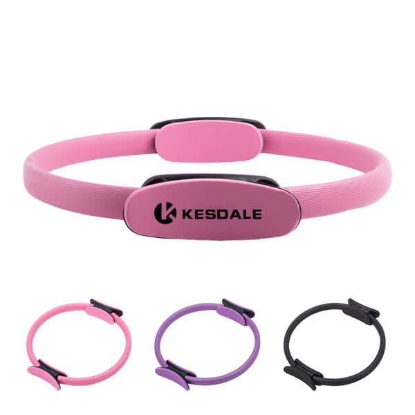 A pink dual grip Pilates ring with black accents, featuring a logo, alongside rings in purple and black. Dual Grip Pilates Ring - Image 1
