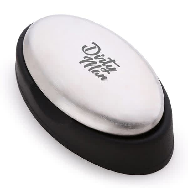 A stainless steel soap with a black base, featuring a logo on the top. The design is oval-shaped. Stainless Steel Soap - Image 1