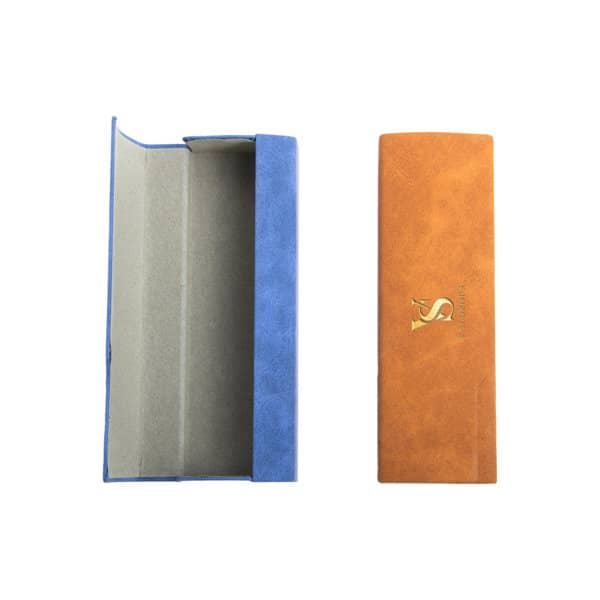 A PU leather eyeglass case featuring a blue and tan design, with a logo present on one side. PU Leather Eyeglass case - Image 1