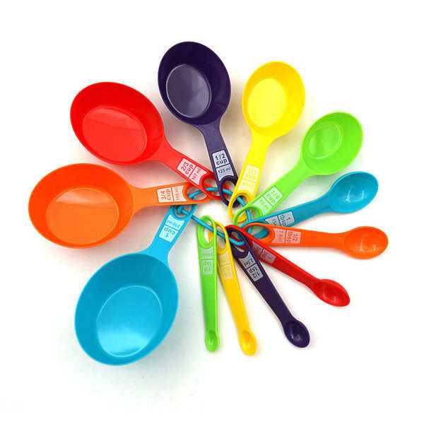 A set of 12 plastic measuring spoons in various colours, including red, orange, yellow, green, blue, and purple. 12 Pcs Plastic Measuring Spoon Set - Image 1