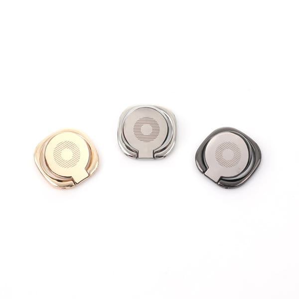 A set of three custom phone ring holders in rose gold, silver, and black finishes, featuring a logo on each. Custom Phone Ring Holder - Image 1