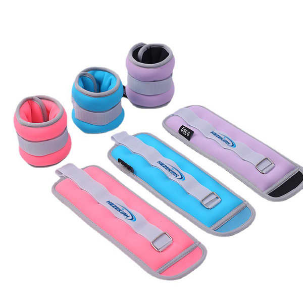 Adjustable ankle and wrist weights in pink, purple, and blue, featuring straps and a logo. Adjustable Ankle Wrist Weight - Image 1