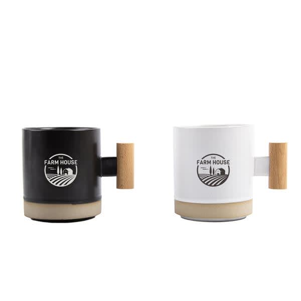 A ceramic mug set featuring a black and a white mug, both with wooden handles and a logo. 13 oz. Wooden Handle Ceramic Mug - Image 1