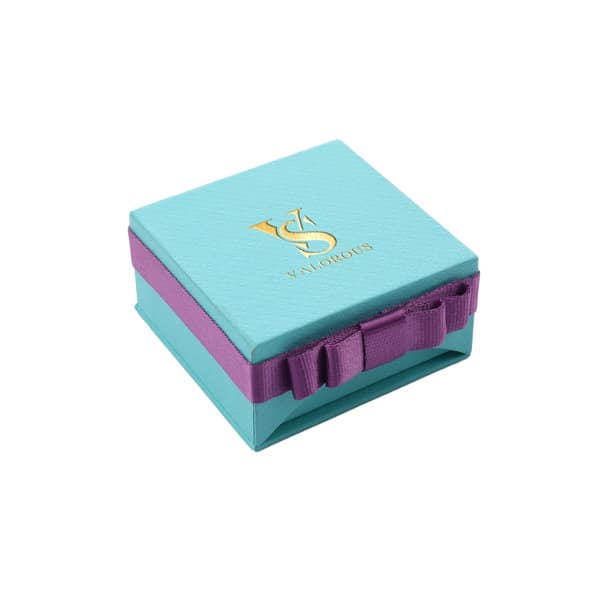 A square, turquoise gift box with a purple ribbon, featuring a logo on the top. Branded Bow Jewelry Necklace Gift Box - Image 1