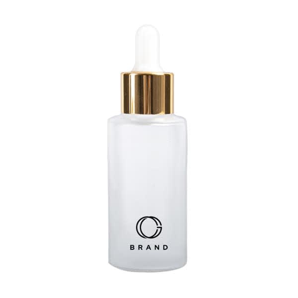 A frosted glass dropper bottle with a white body and a gold lid, featuring a logo. 1 oz. Frosted Dropper Bottle - Image 1