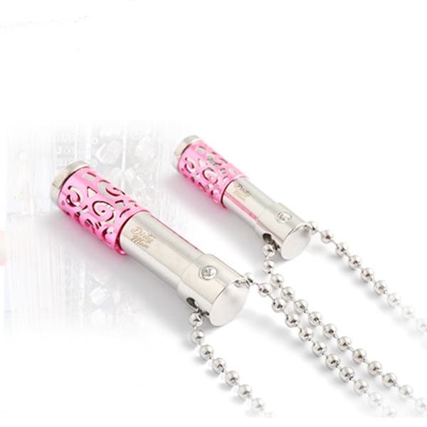 A pink and silver perfume bottle pendant necklace with intricate cut-out designs and a bead chain. Perfume Bottle Pendant Necklace - Image 1