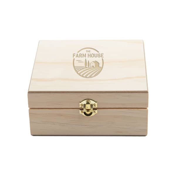 A wooden essential oil box with a natural finish, featuring a logo on the lid and a gold lock. 25 Slot Wooden Essential Oil Box - Image 1
