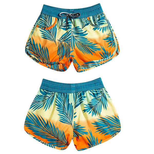 Quick dry beach shorts in orange and yellow with a tropical leaf pattern, featuring an elastic waistband and drawstring. Custom Women's Quick Dry Beach Shorts - Image 1