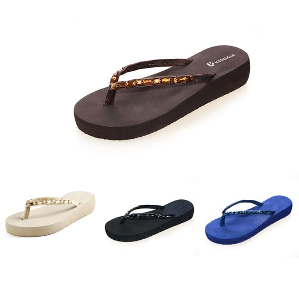 Slim Rock Flip Flops in black, white, navy, and a brown variant with decorative straps. Features a simple logo. Slim Rock Flip Flops - Image 1