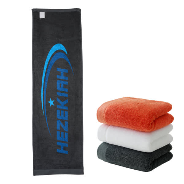 A black sports towel with a logo beside stacked towels in orange, white, and grey colours. 100% Cotton Sports Towel - Image 1