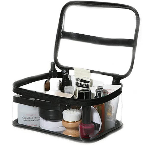 A black waterproof transparent cosmetic bag filled with various skincare and beauty products. Waterproof Transparent Cosmetic Bag - Image 1
