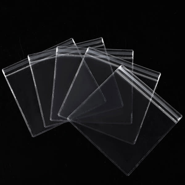 A set of clear plastic seal bags in various sizes, featuring a zip-lock closure and arranged on a black background. Custom Clear Jewelry Seal Bag - Image 1