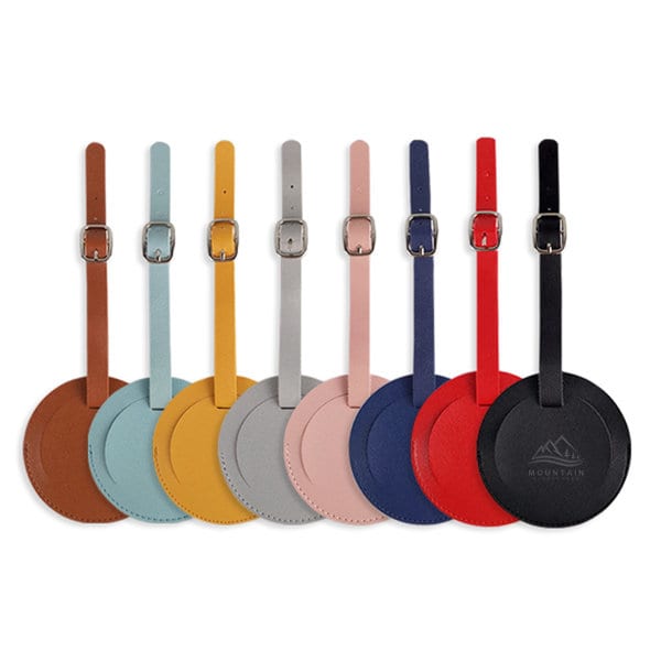 A set of round thickened PU leather luggage tags in various colours including brown, blue, yellow, grey, pink, red, and black, with one logo. PU Leather Round Thickened Luggage Tag - Image 1