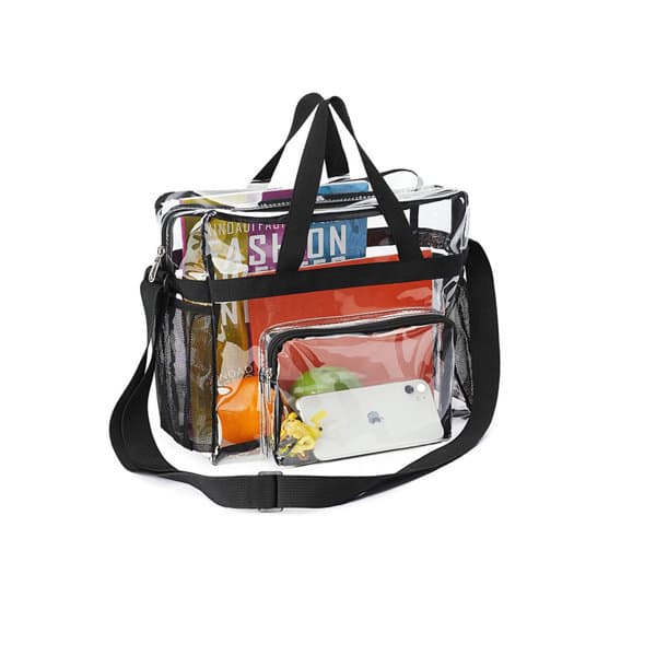 A large clear tote bag with a black shoulder strap, filled with various items and featuring a smaller clear pouch. Large Capacity Clear Bag With Shoulder Strap - Image 1