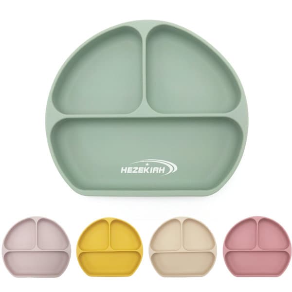 A silicone baby feeding plate featuring compartments in green, yellow, pink, and beige, with a branding logo. Silicone Baby Feeding Plate - Image 1