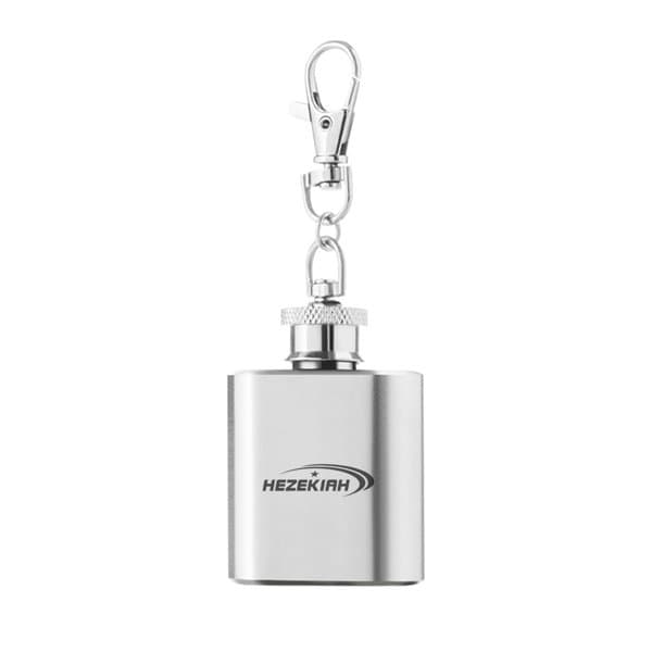 A stainless steel flask keychain with a silver finish and a clip. It features a logo on the front. 1 oz. Custom Stainless Steel Flask Keychain - Image 1