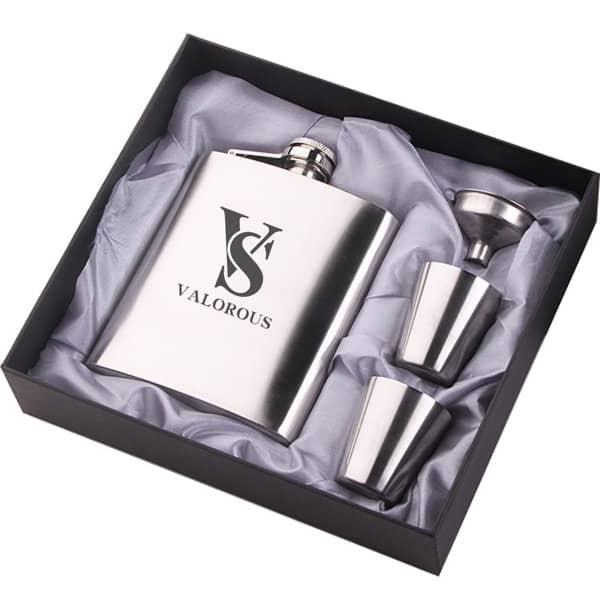 A silver 7 oz. hip flask gift set with two stainless steel cups and a branded flask, presented in a black gift box. Personalized 7 oz. Hip Flask Gift Set - Image 1