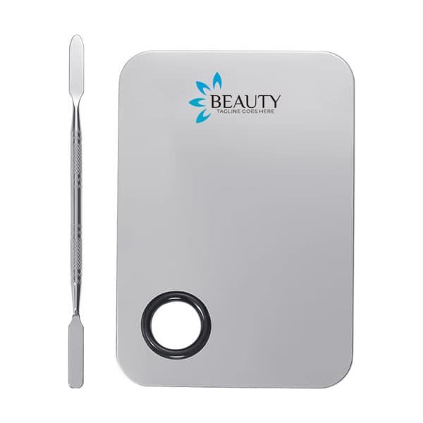 A stainless steel makeup palette set in silver, featuring a logo and a spatula for application. Stainless Steel Makeup Palette Set - Image 1