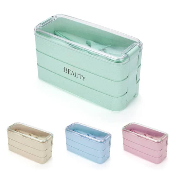 A stackable bento box in mint green, with pink, blue, and beige options visible. Features a logo on the front. 3-layer Wheat Straw Stackable Bento Box - Image 1