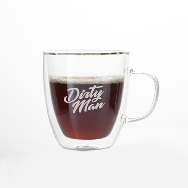 A glass coffee cup with a handle, featuring a transparent design and filled with dark liquid. 15 oz. Insulated Glass Coffee Cup With Handle - Image 1