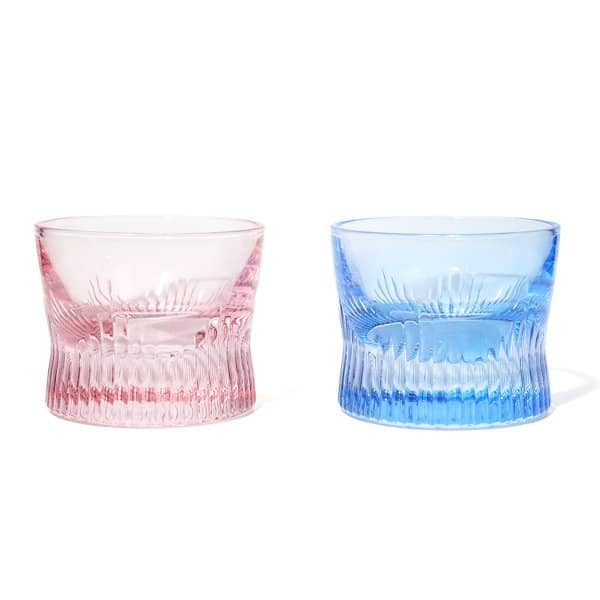 A set of two crystal whiskey corset glasses, one in pink and one in blue, featuring intricate textured designs. 3.5 oz. Crystal Whiskey Corset Glass - Image 1