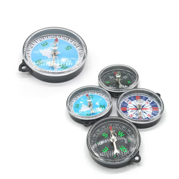 A set of five mini compasses in various sizes, featuring black cases and colourful directional markers. Mini Compass Keychain - Image 1