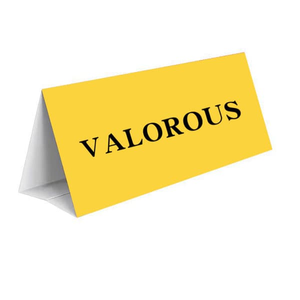 A yellow triangular desk name plate with the word "VALOROUS" printed in black. It features a simple, clean design. Paper Triangle Desk Name Plate - Image 1
