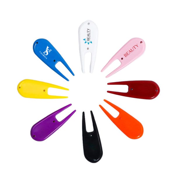 A collection of golf divot forks in various colours, including blue, white, pink, yellow, purple, black, and orange, with logos. Golf Divot Fork - Image 1