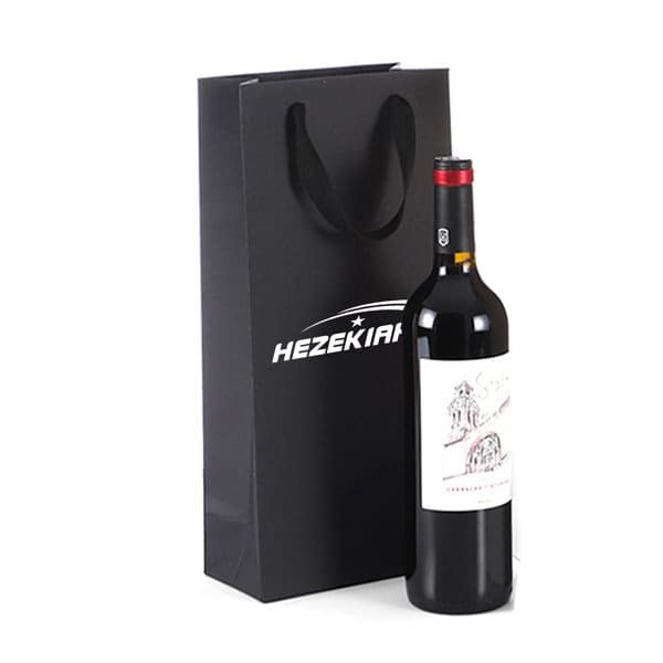 A drink bottle in a sleek black cardboard bag with a logo and sturdy handles. Double Bottle Black Cardboard Wine Bag - Image 1