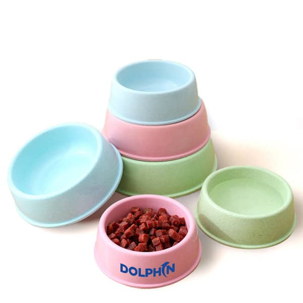A set of wheat straw pet food bowls in pastel colours: pink, blue, green, and a bowl with pet food. Features a logo. Wheat Straw Pet Food Bowl - Image 1