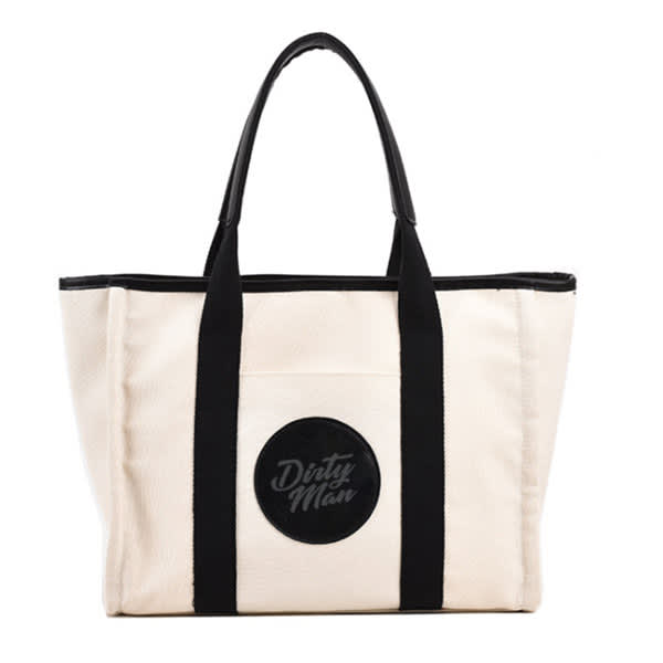 A large capacity canvas tote bag in cream with black handles and a circular logo. Large Capacity Canvas Tote Bag - Image 1